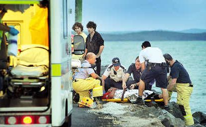 Emergency services attend to the injured driver of a 4WD that ran off the rock wall and into the ocean. Emergency services attend to the injured driver of a 4WD that ran off the rock wall and into the ocean.